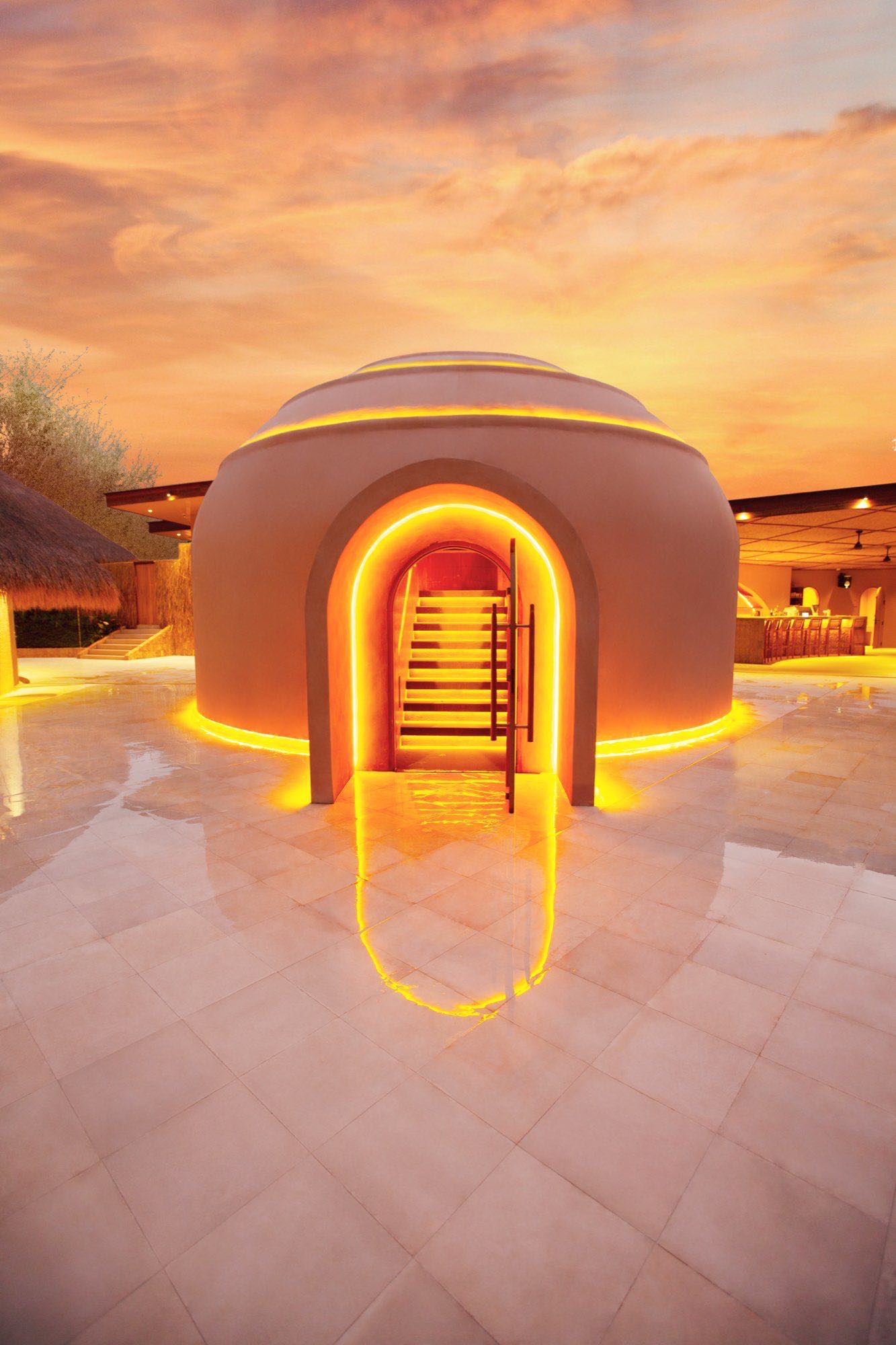 The sauna dome glowing at dusk